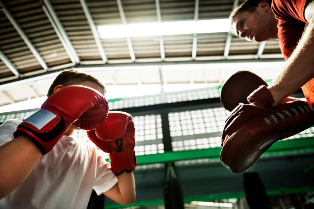boy-boxing-training-punch-mitts-exercise-concept