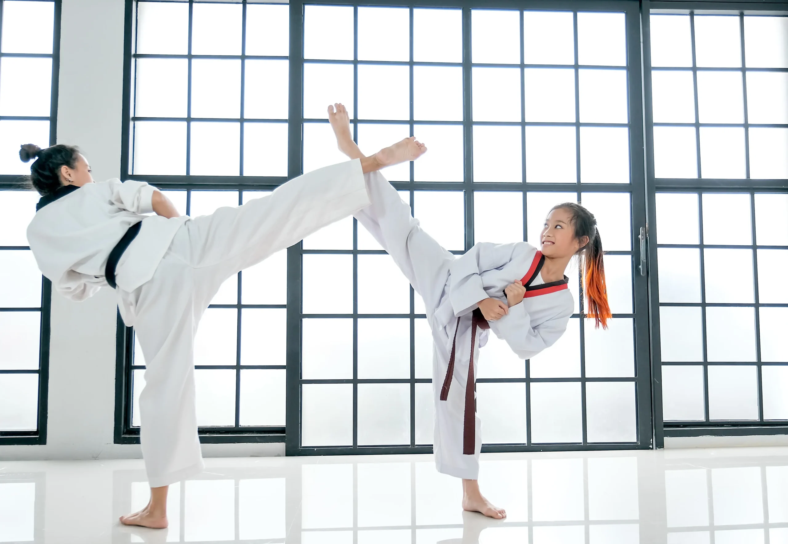 young-teacher-of-taekwondo-and-her-student