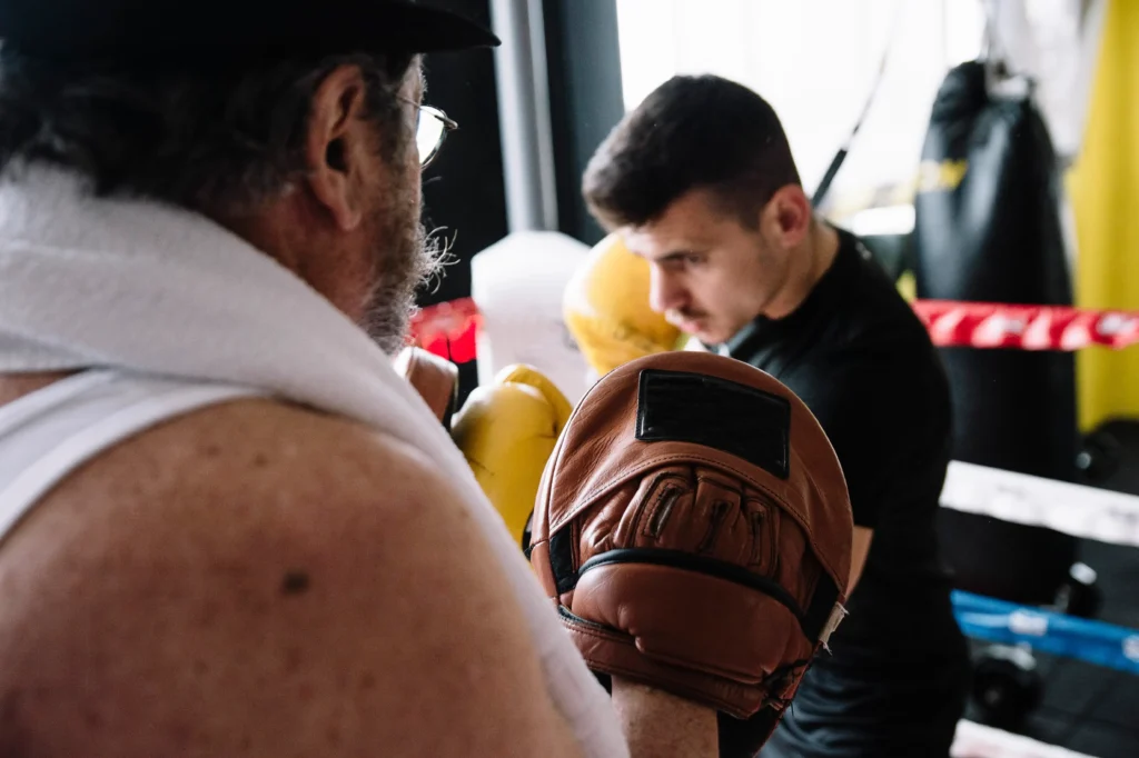 boxer and trainer learning to punch 1