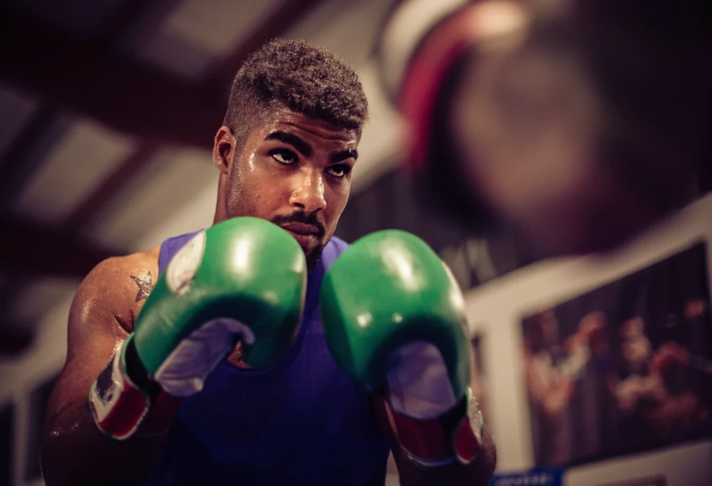 focused boxer training hard in the gym